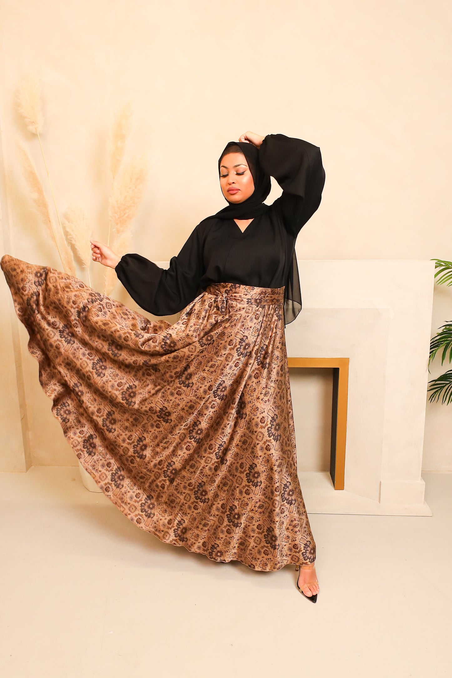 Amal flared Abaya in a black Nidah and Persian floral print
