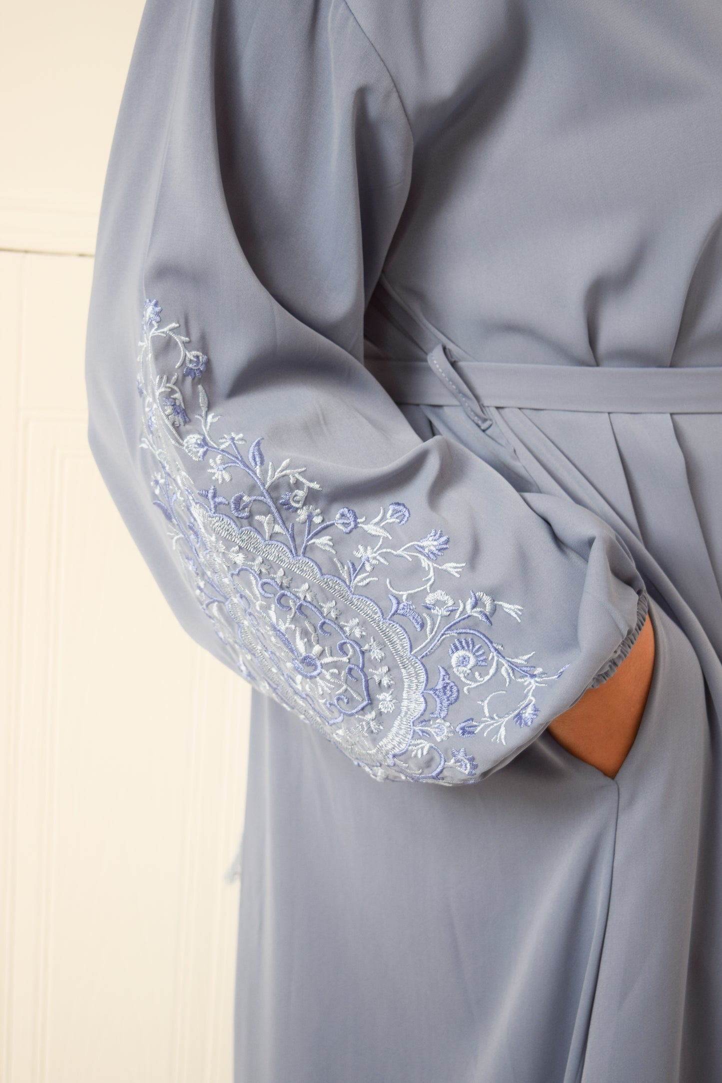 Sofia Long plain abaya dress with long sleeves, pockets and embroidery detail Powder Blue